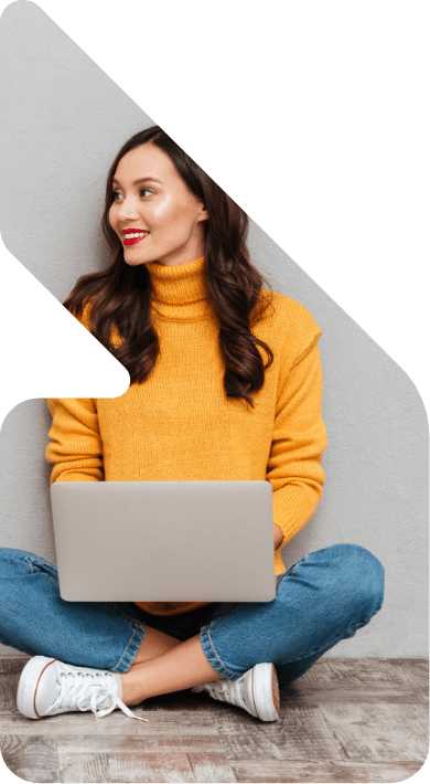 Image showing a woman sat on the floor using a laptop
