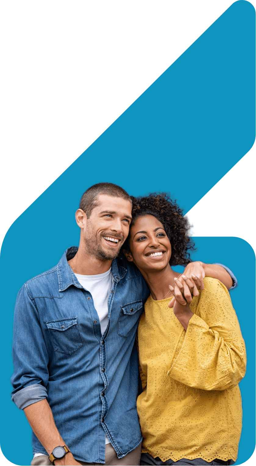 Image showing a smiling couple with their arms around each other