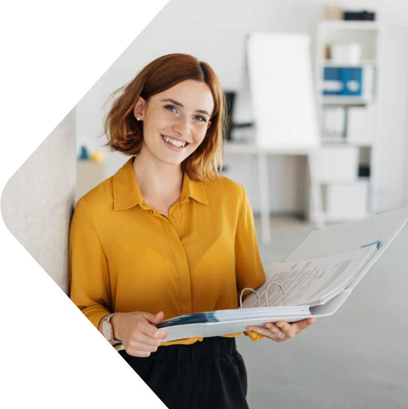 Image showing a woman in business attire holding a folder