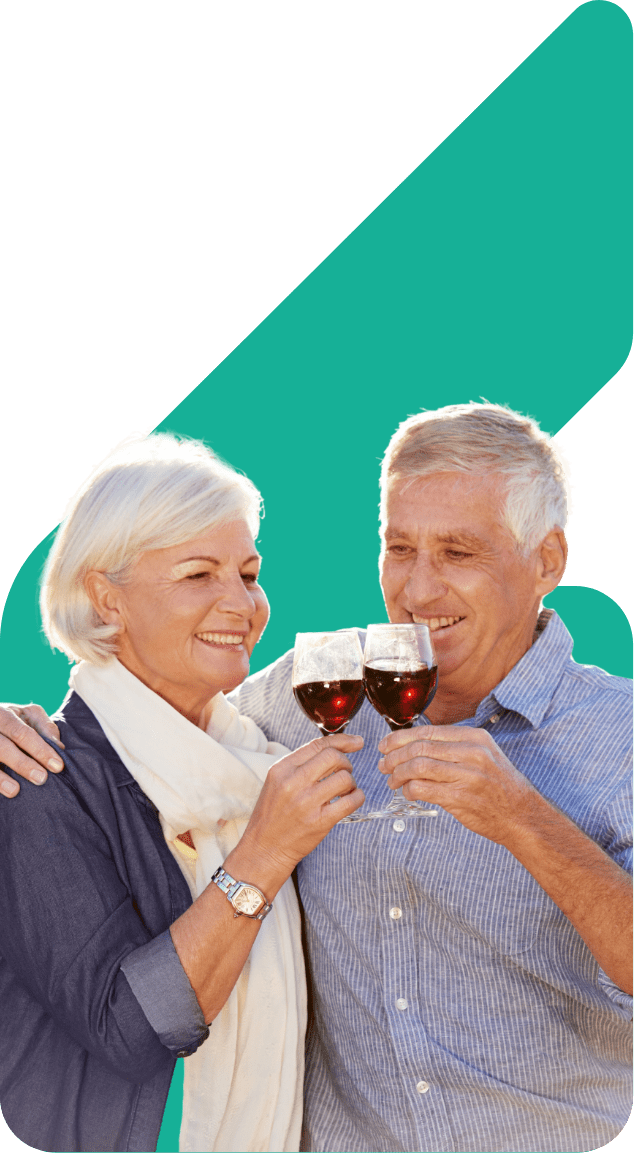 Image showing an older couple clinking two glasses of red wine