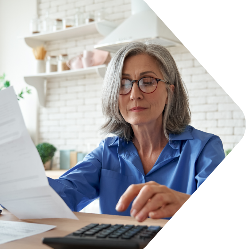 Image of an older woman using a calculator