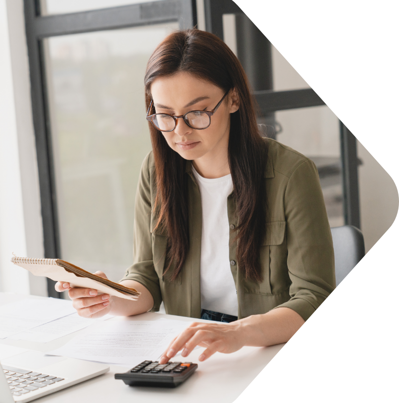 Image showing a woman using a calculator