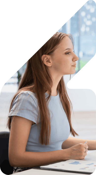 Image of a woman in front of a desk