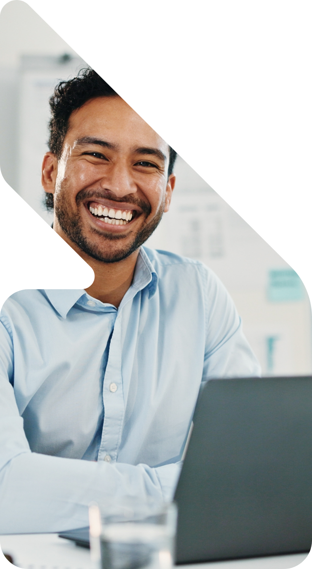 Image showing a wealth manager smiling in front of a laptop