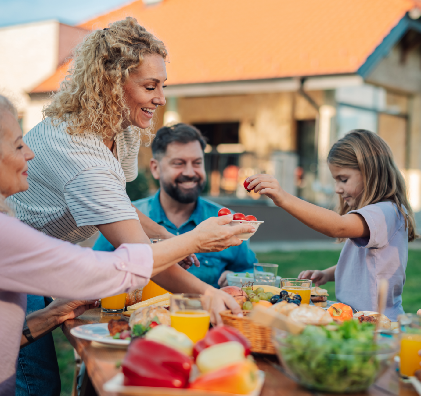Image showing a family having dinner in their garden