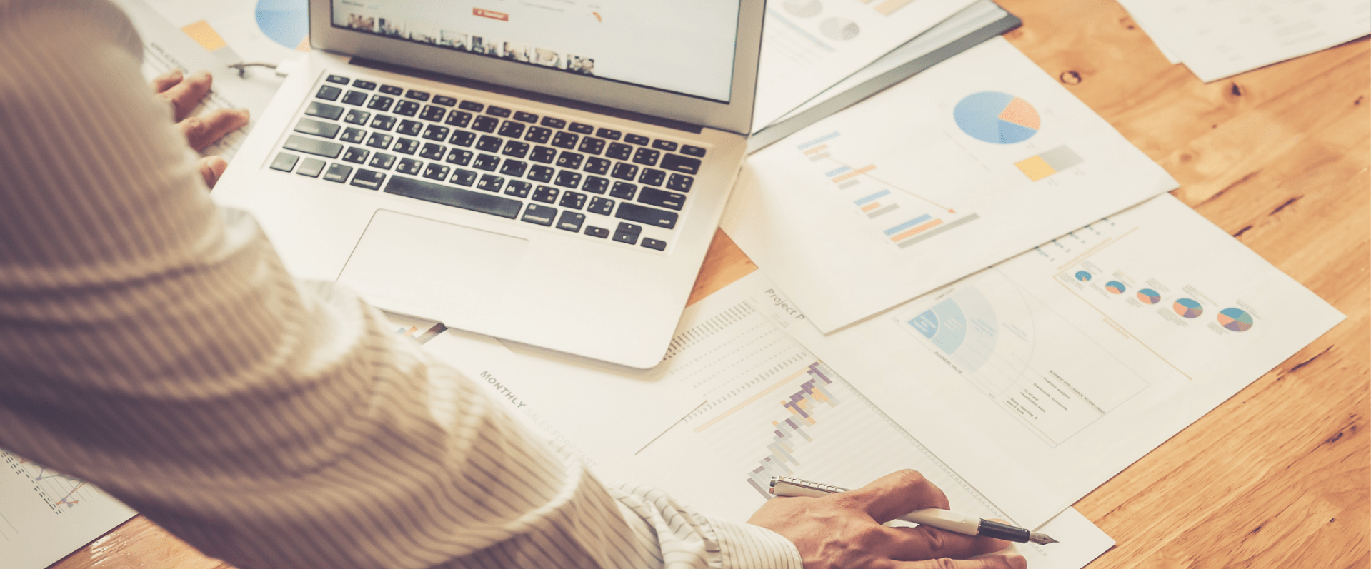 Image showing a close up of a man looking at some graphs